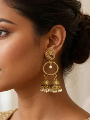 Peacock jhumka earrings : Grace of the peacock, charm of tradition – double jhumka with pearls and stones.