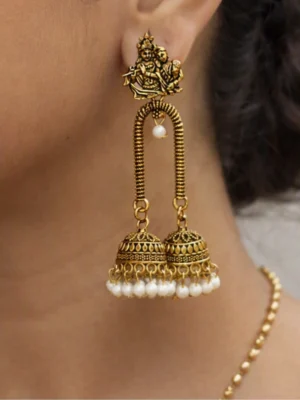 Antique gold jhumka :  temple‑inspired gold jhumkas that radiate grace.