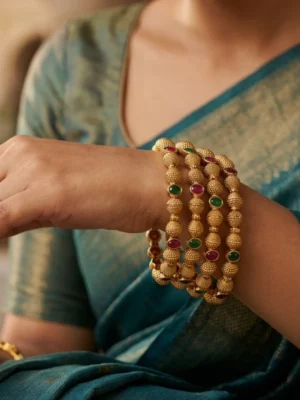 Traditional charm with modern shine — Minah26 gold bangles.