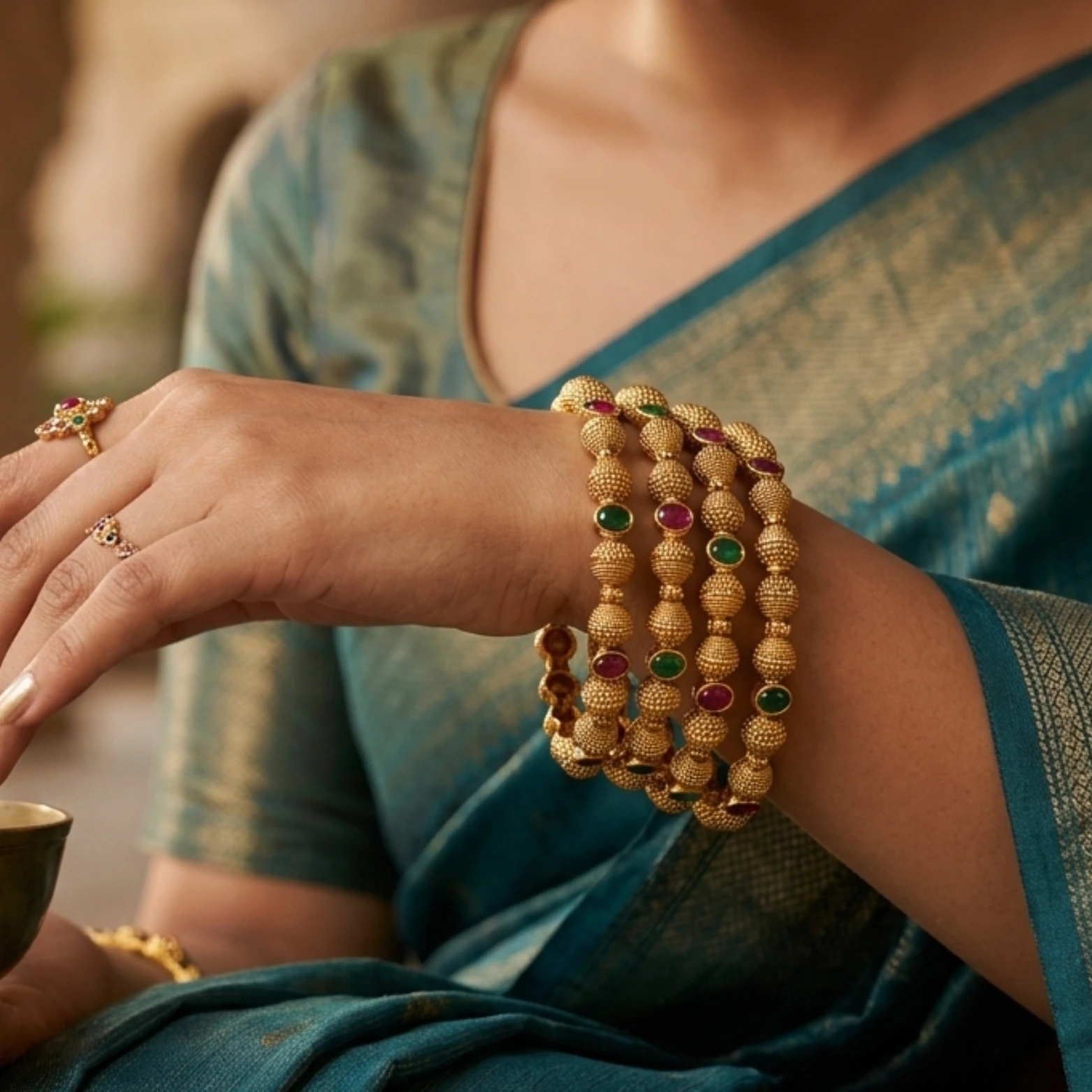 Traditional charm with modern shine — Minah26 gold bangles.