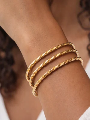 Gold twisted bangles